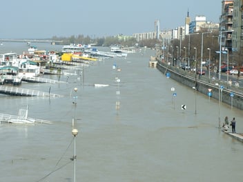 A flooded marina, most of the boats are completely flooded